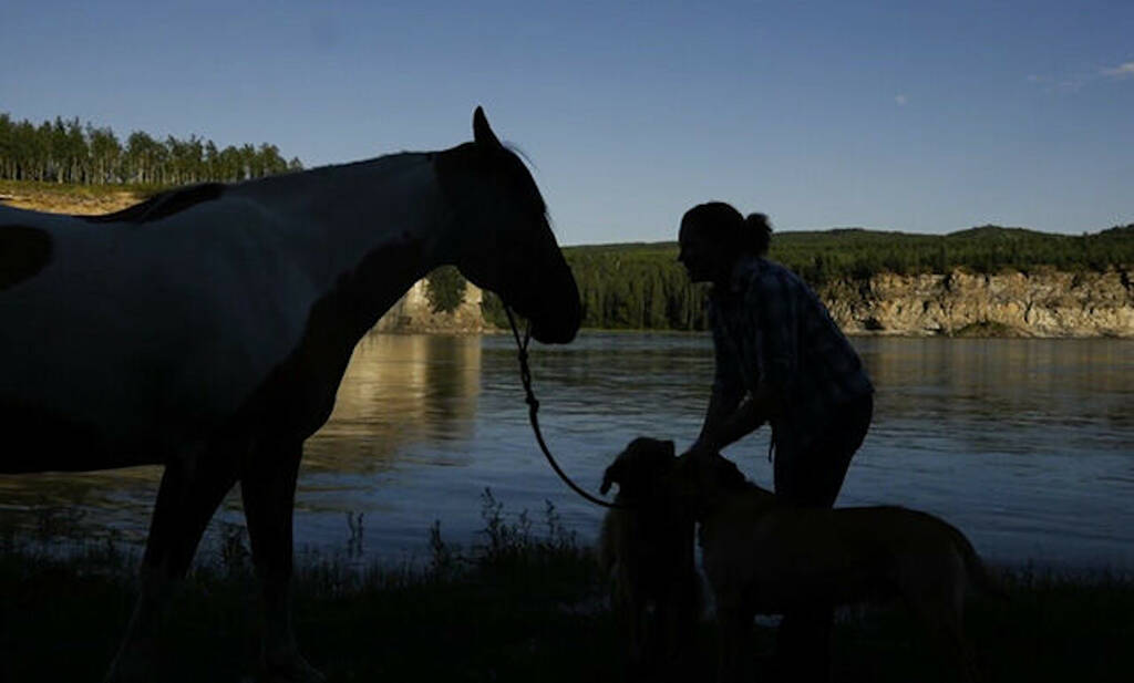 Valley Of The Southern North: person with horse next to water